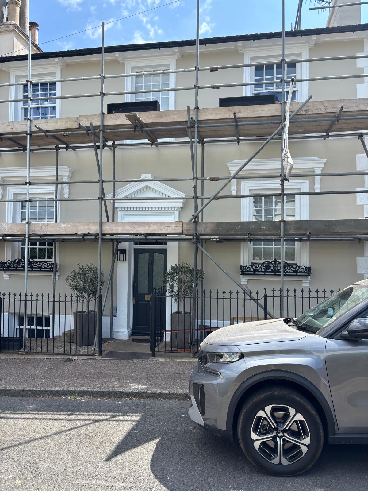 Terrace townhouse covered in scaffolding during external redecoration